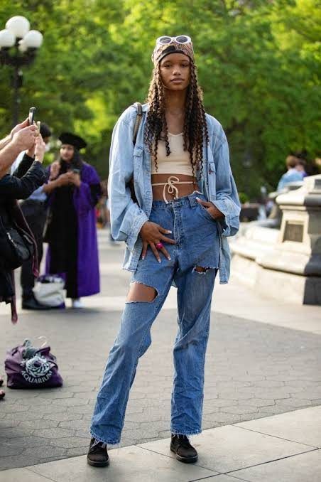 Model in a vintage wash denim jacket and jeans